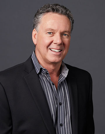 Professional headshot of John Gallogly, South Orange County real estate team