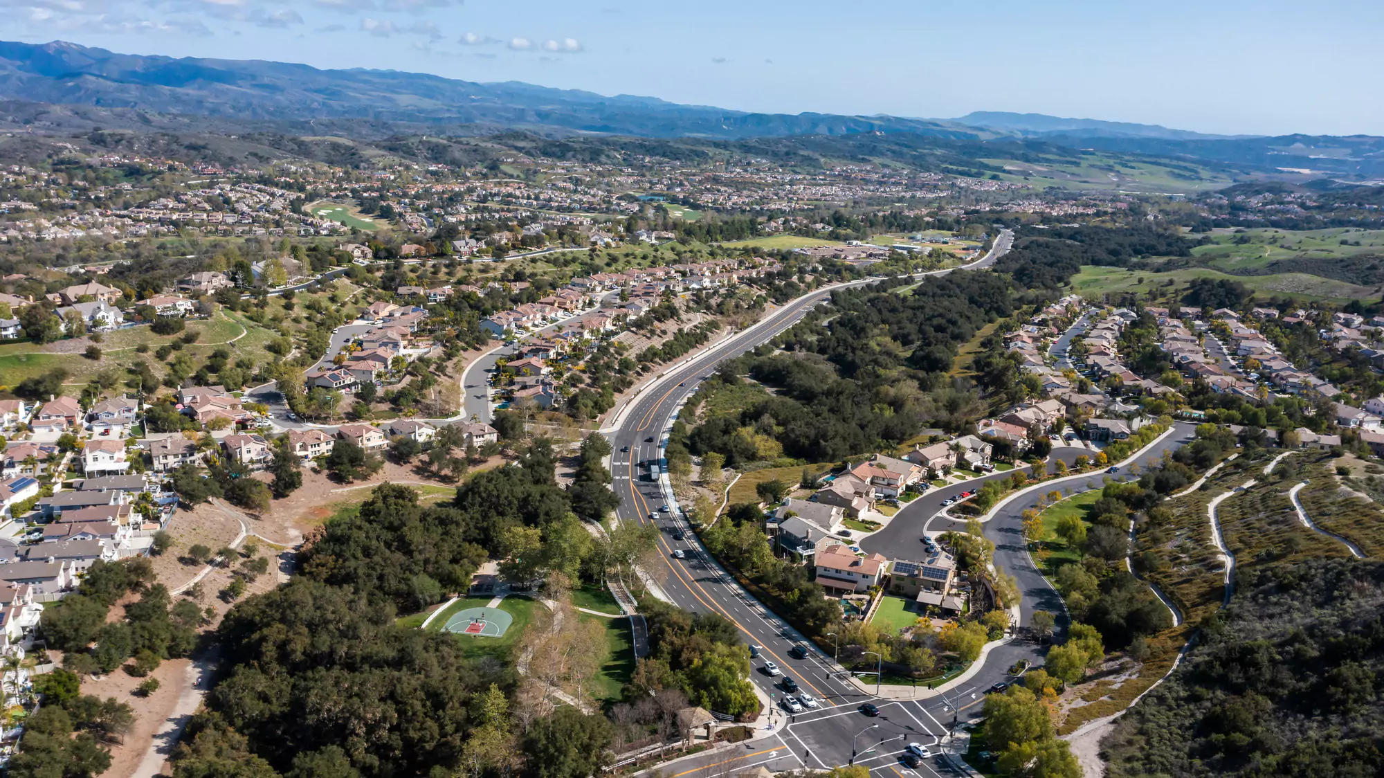 Aerial view of Coto de Caza luxury homes and neighborhoods under clear skies